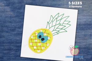 Pineapple with green leaf on the top having big blue eyes applique